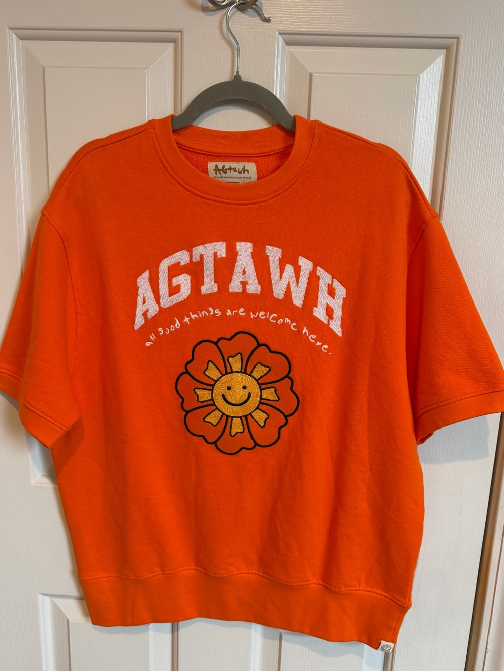 NWOT Orange Graphic Tee with Smiley Flower Size S Brand AGTAWH